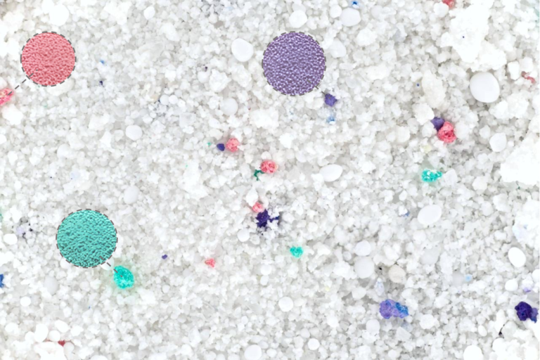 colored speckles in detergent powder close up