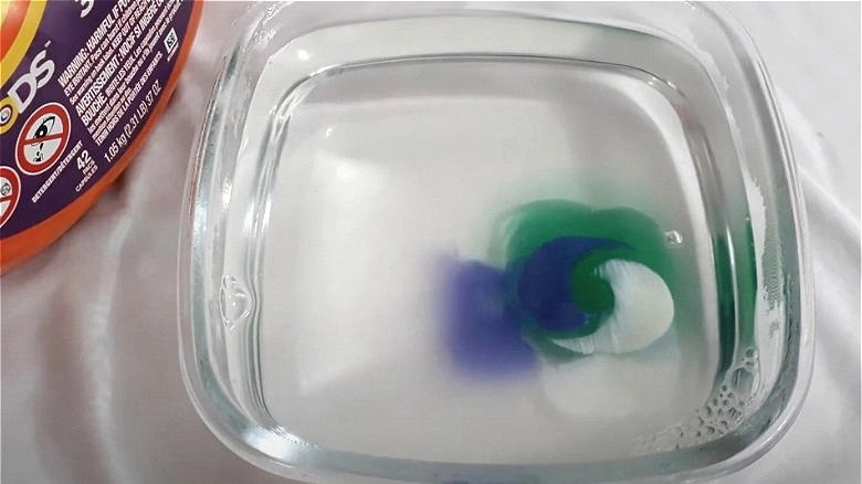 detergent pod dissolving in water