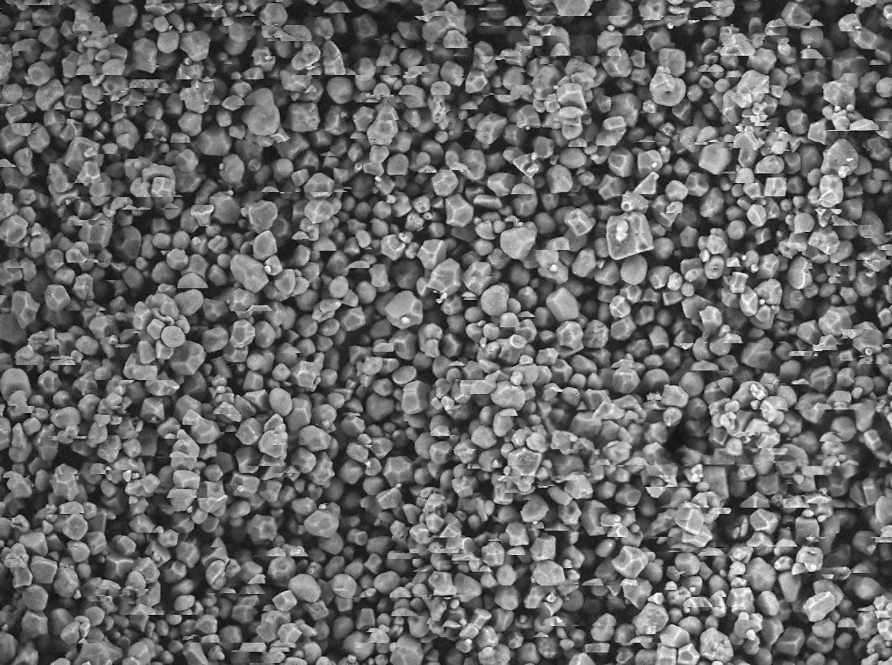 microscope view of colored speckles