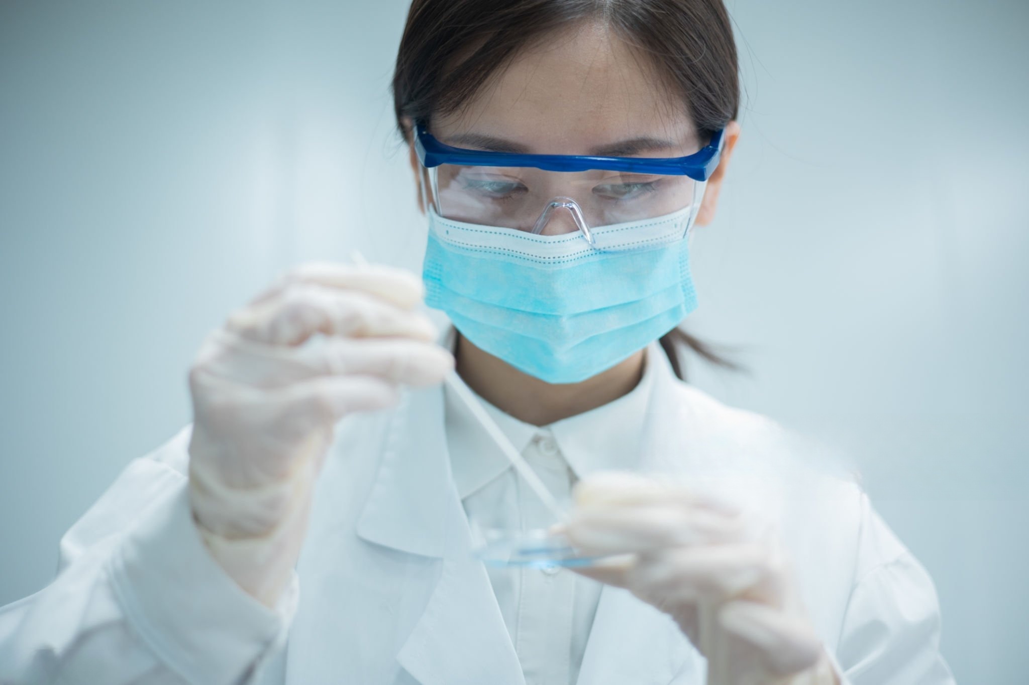 chemical scientist wearing PPE,testing LAB sample