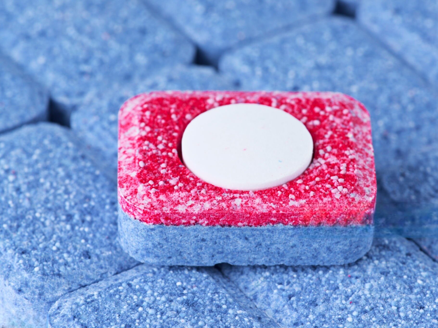 colored speckles in detergent tablet